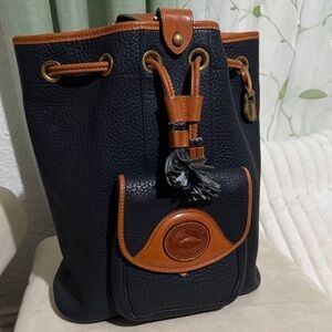 Vintage Navy and Brown Leather Bucket Bag Dooney & Bourke  
Can hold 8x10 books